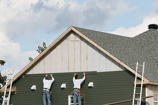 Professional Storm Damage Siding Repair technician working in Sayville, NY